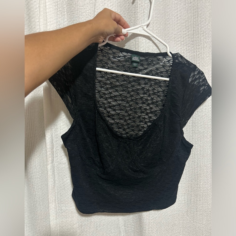Never worn- lace mesh top. See through only from the back- never worn.